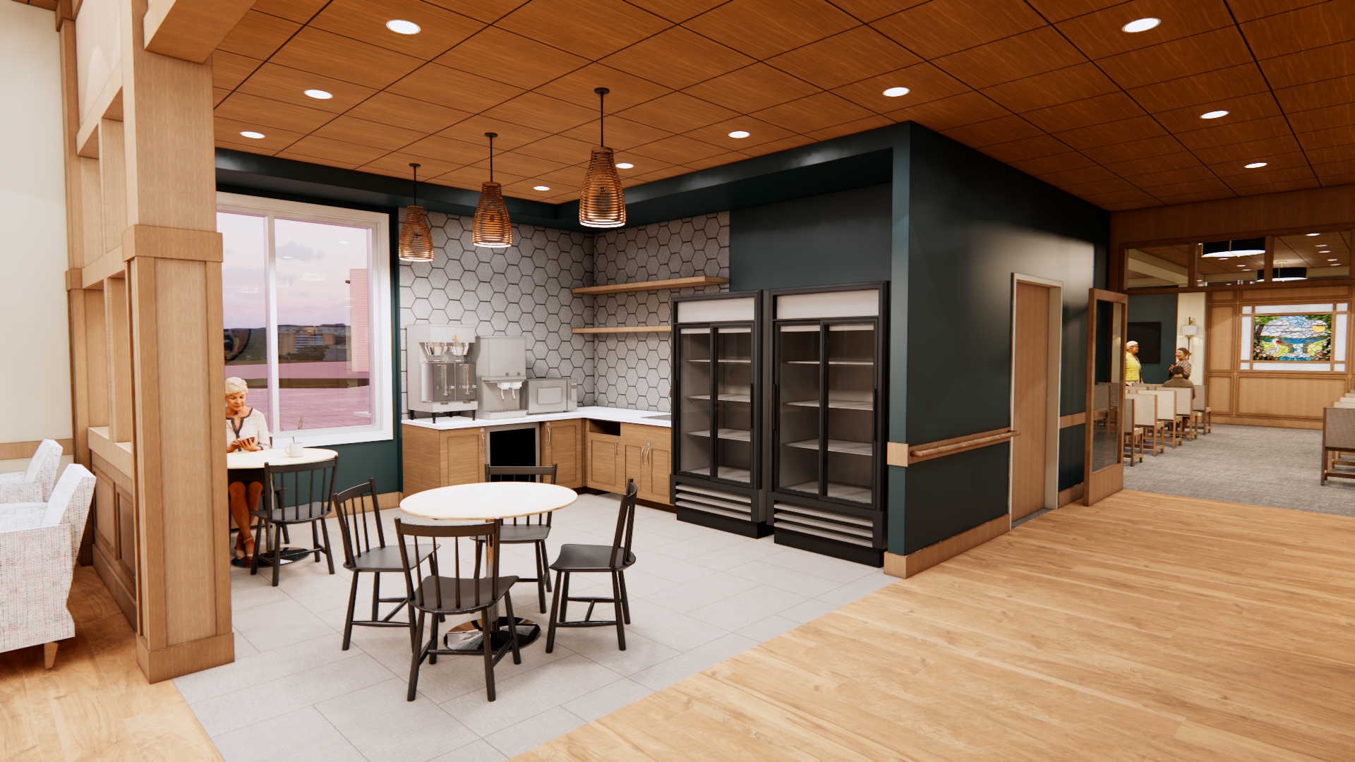 Interior architectural rendering of the centrally located Pelican Valley Senior Living café. The bright, welcoming social space features a kitchenette with light wood cabinetry, a hexagonal tile backsplash, and modern beverage stations. Small round dining tables and black spindle-back chairs sit beneath bronze pendant lights, framed by warm wood pillars and a deep green accent wall.